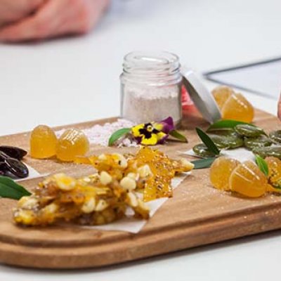 An example of native food confectionery creations from past UQ students, including medicinal lozenges flavoured with lemon myrtle, a bunya and boppal brittle, a quandong and burdekin plum sherbet, desert lime jubes and sour lollies from Davidson plums.